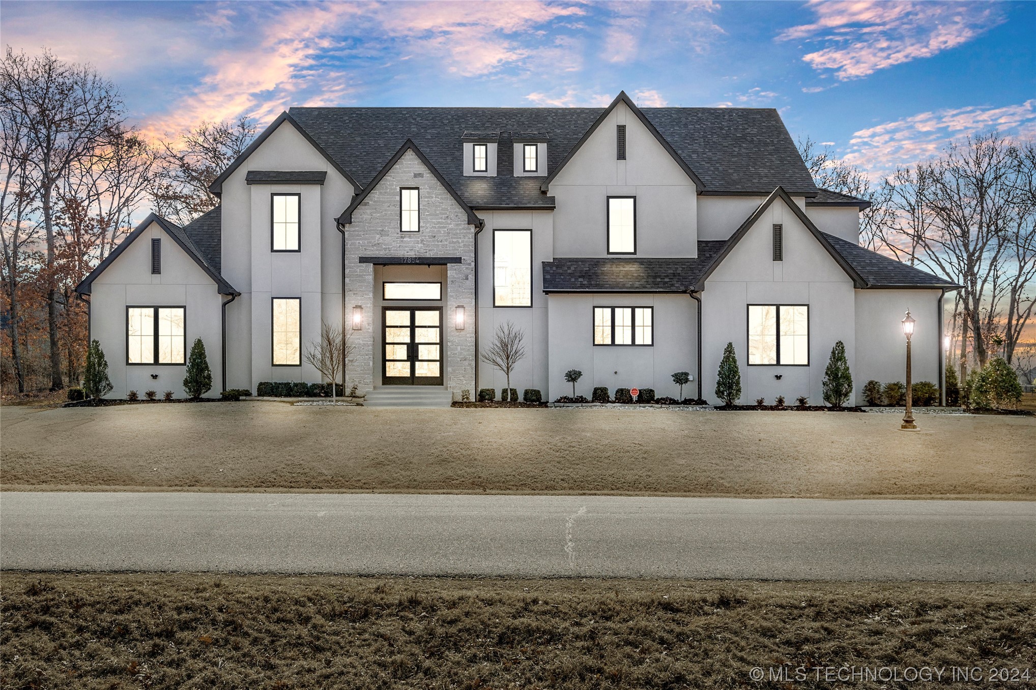 Luxury new-construction home in Owasso, Oklahoma at dusk